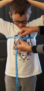 Measuring the chest of a child